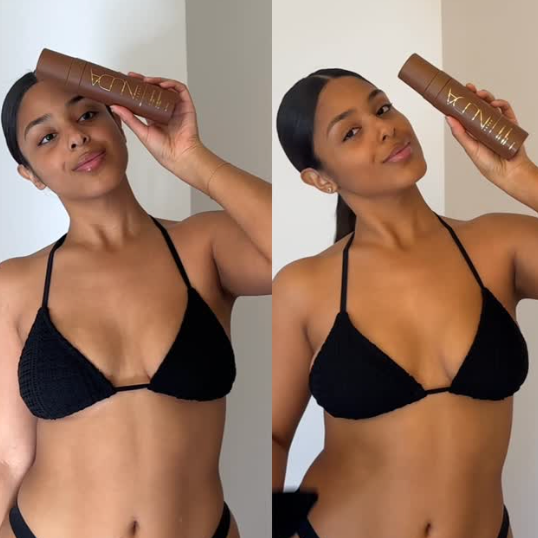 Woman in a black bikini holding a bottle of hair product against a white background
